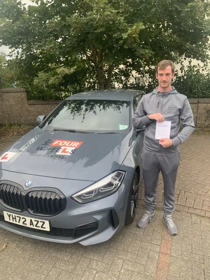Alex celebrating passing their driving test with Hugh's Wheels