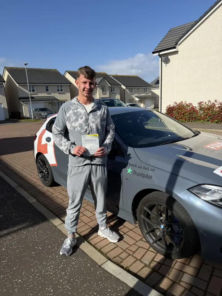 Cian celebrating passing their driving test with Hugh's Wheels