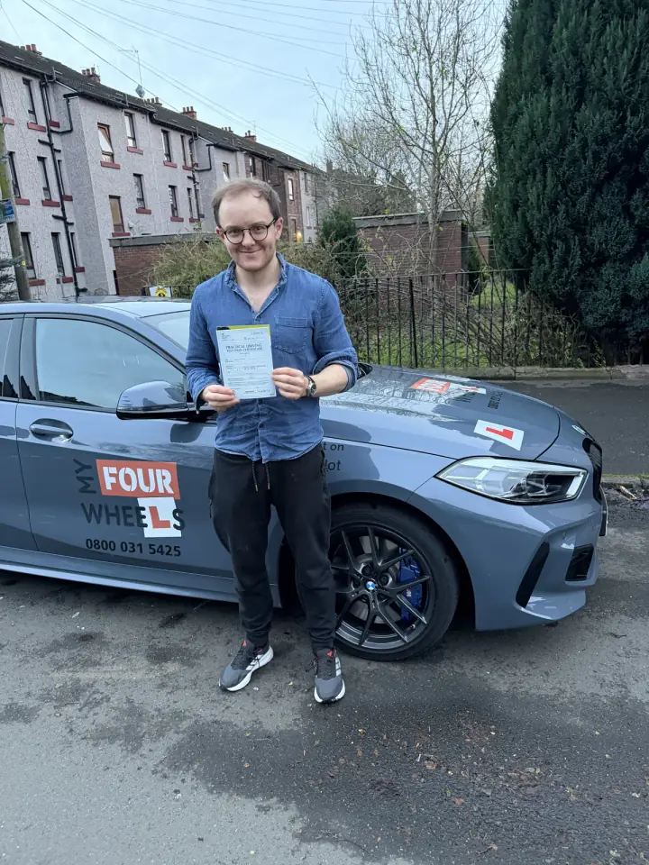 James celebrating passing their driving test with Hugh's Wheels